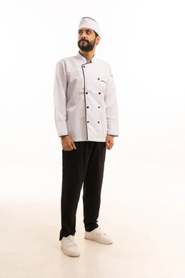 Professional Saudi cooking profession, standing straight and serious expression, portrait of a Saudi Arabian Gulf chef wearing a cooking uniform looking at something with confidence and pride, full body, white background