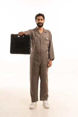 Skill and mastery of work, using maintenance equipment to make repairs, portrait of a Saudi Arabian Gulf man wearing a work uniform holding a tool bag, full body, white background