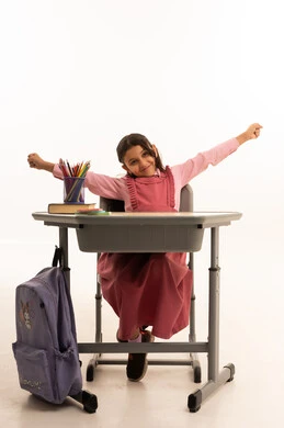Gestures of drowsiness, fatigue and exhaustion, portrait of a Saudi Arabian Gulf Arab student wearing a school uniform neglecting her lessons, negatives of distance learning, wasting time, white background