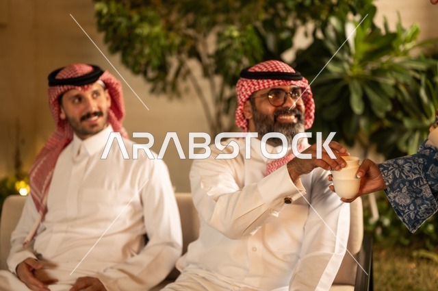 Working in the healthcare sector in Saudi Arabia, providing healthcare and taking care of patients' health, a Saudi Arabian Gulf Arab doctor wearing a traditional dress examining a girl using a stethoscope at home, using a stethoscope to hear a heartbeat