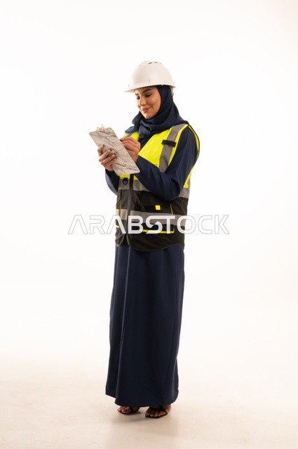 Recording and writing engineering notes, the role of structural engineering in the development of Saudi society, the role of structural engineering in the development of Saudi society, a portrait of an Arab Gulf Saudi Muslim engineer wearing a white helmet and safety vest, full-body, white background.