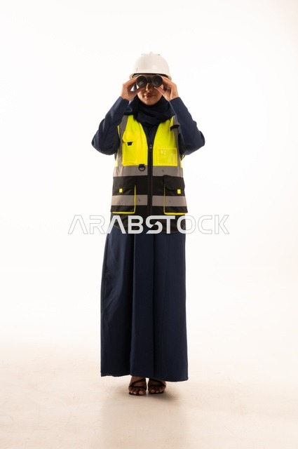 The role of structural engineering in the development of Saudi society, looking through a lens at something and standing with a straight back, professions and jobs for women in the engineering sector, a portrait of an Arab Gulf Saudi Muslim woman wearing a hijab, wearing a white helmet and safety vest, full-body, white background.