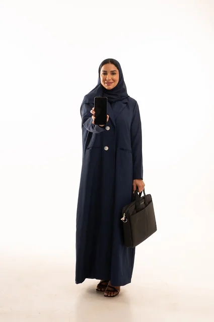 A black screen background on a mobile phone working through modern technologies, a portrait of a smiling Saudi Gulf Arab woman wearing an abaya holding a business bag, the elegance of Gulf women, attention to external appearance, full-length body, white background.