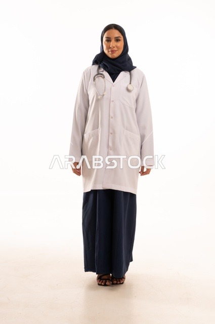 Attention to appearance, looking at the camera with gestures of self-confidence, providing medical examinations and treatment services, a close-up portrait of a smiling Saudi Gulf Arab female doctor wearing a lab coat and stethoscope, the concept of femininity and softness, white background.