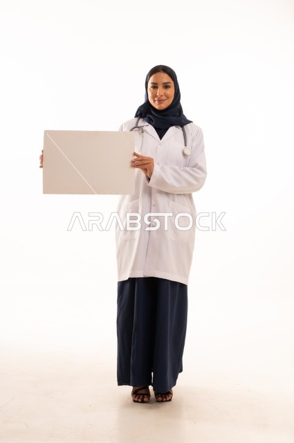 Marketing offers and advertisements, explanatory boards and educational tools, a portrait of an Arab Gulf Saudi female doctor wearing an abaya and a white apron holding a blank rectangular white board in her hands, a young Saudi woman looking at the camera with expressions of determination and seriousness, a rectangular white mockup, white background.