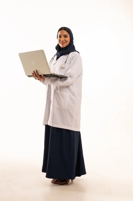 Facial expressions of joy, following work using technology, using advanced modern technology in practical life, a portrait of a Saudi Gulf Arab woman wearing a hijab and abaya working on a laptop, browsing social media, full-body image, white background.
