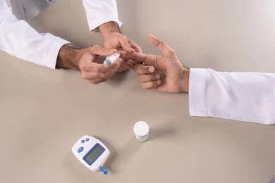 Modern electronic devices for diabetes patients, problems of high blood sugar, physical pain and medical conditions, close-up portrait of the hands of an Emirati Arab man checking blood sugar levels, healthcare and rapid medical examination, white background.