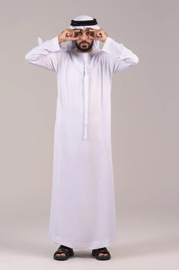 Increased eye pressure, corneal inflammation, a portrait of a sick Emirati Gulf Arab man wearing a kandura and ghutrah, opening his eyes with his hands, redness and pain in the eyes, eye problems and medical conditions, the need for examination and treatment, full body length, white background.