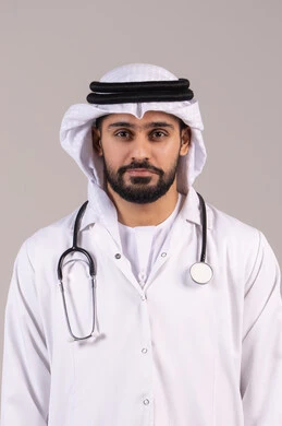 Medical examination and providing treatment services to patients, standing upright with gestures of self-confidence, working in the health sector in the UAE, a portrait of an Arab Gulf Emirati doctor wearing a kandura and ghutrah and a medical coat, holding a stethoscope and looking at the camera, white background.