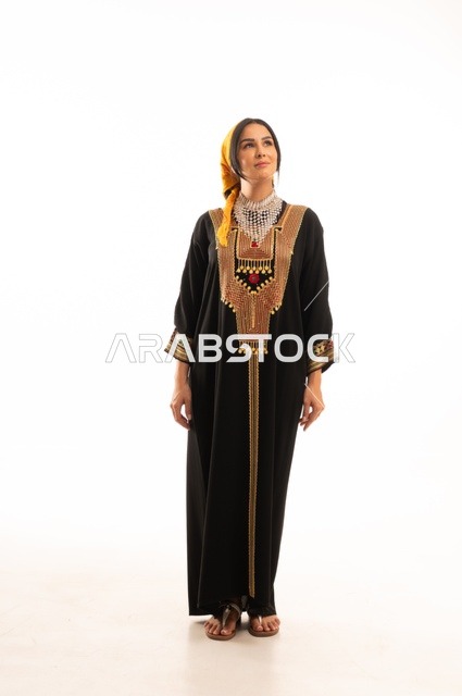 The anniversary of the establishment of the first Saudi state is February 22, the day we began in 1727 AD, wearing the traditional attire of the central region, celebrating popular national occasions and holidays, a portrait of a smiling Saudi Gulf Arab woman wearing the kurta and headscarf, full-body, white background.
