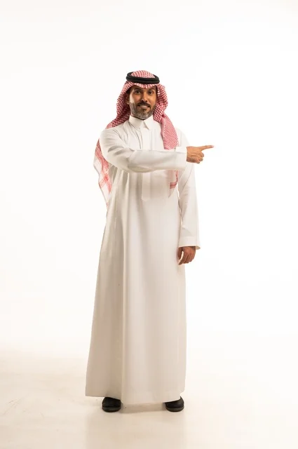 Hand gestures go in this direction, concern for appearance and elegance, expressions of joy and love, a portrait of a Saudi Gulf Arab man wearing traditional attire, a young Saudi, the concept of expression through gestures, a full-body image, white background. Hand gestures go in this direction, concern for appearance and elegance, expressions of joy and love, a portrait of a Saudi Gulf Arab man wearing traditional attire, a young Saudi, the concept of expression through gestures, a full-body image, white background.