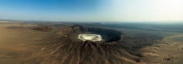 Historical archaeological landmarks, natural rocky mountains and highlands, the Wabah Crater (Tamiah Quarry) in the city of Taif, volcanic lava on the slope of the Wabah Crater, tourism in the Kingdom of Saudi Arabia.