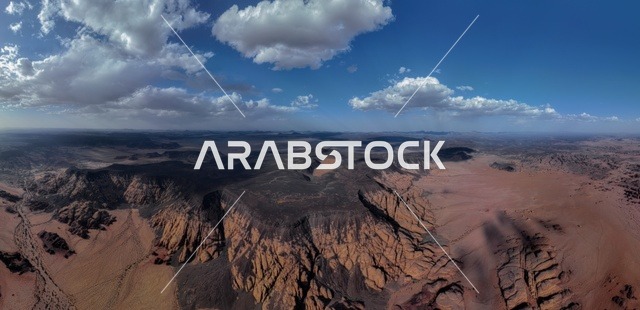 الطبيعة الجبلية والصخرية لمنطقة تبوك في المملكة العربية السعودية، التلال والكثبان الرملية اللامعة في المناطق الصحراوية   ، المعالم السياحية التاريخية المشهورة، سلاسل الجبال الشامخة والقمم العالية والمنحدرات، التضاريس والطرق الوعرة والبيئة الجافة ، صورة لجبال تدرع احد المعالم الجميله في حرة عويرض جنوب تبوك