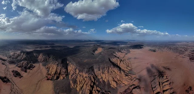 The mountainous and rocky nature of the Tabuk region in the Kingdom of Saudi Arabia, the hills and shining sand dunes in the desert areas, the famous historical tourist landmarks, the towering mountain ranges and high peaks and slopes, the rugged terrain and rough roads and the dry environment, a picture of the Tadr'a Mountains, one of the beautiful landmarks in the Hara Awairid south of Tabuk.