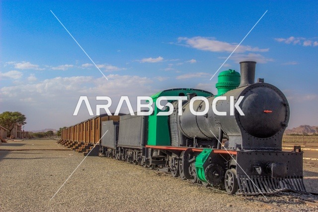 Ancient means of transportation and communication, the restored Hejaz train in the Al-Ula station museum, archaeological tourist sites in Saudi Arabia, railway lines in the Kingdom, the concept of travel and tourism.