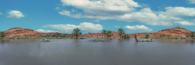 The Nafud Al-Hafir desert in the Hail region of the Kingdom of Saudi Arabia, natural desert tourist spots in Saudi Arabia, the view of clouds and white clouds in the sky, a panoramic view of the Aqda area in Hail.