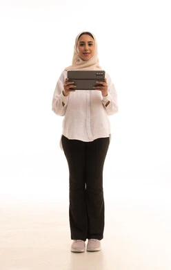 Integrating technology into daily and professional life, a portrait of a young Arab Gulf Saudi woman wearing a hijab in casual attire using a tablet, browsing social media sites, the concept of remote project completion, full-body shot, white background. Integrating technology into daily and professional life, a portrait of a young Arab Gulf Saudi woman wearing a hijab in casual attire using a tablet, browsing social media sites, the concept of remote project completion, full-body shot, white background.