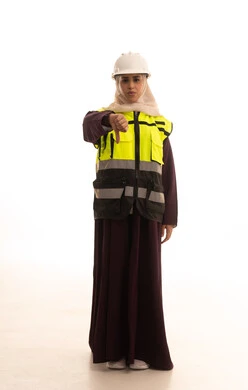 The feeling of rejection and refusal, the progress and development of the UAE by the sons of the nation, the concept of engineering and construction work, a portrait of a veiled Saudi Gulf Arab engineer wearing a jacket and a safety helmet, lowering her thumb in gestures of annoyance, full-body, white background.