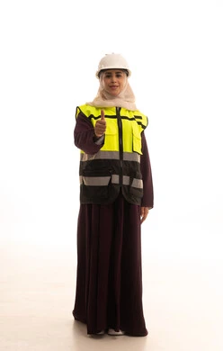 Women's jobs and professions, engineering project management, a portrait of an Arab Gulf Saudi engineer wearing a helmet and safety vest raising her index finger in gestures of admiration, working in the engineering sector, full-body image, white background.