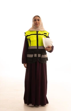 Work in the Saudi engineering sector, the advancement and development of Saudi Arabia at the hands of the nation's sons, professions and jobs for women, the concept of engineering and construction work, a portrait of a veiled Arab Gulf Saudi engineer wearing an abaya with a jacket holding a safety helmet in her hand, full-body, white background.