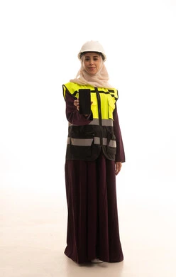 A black screen displayed on a mobile phone, the concept of engineering and architectural construction, development by the hands of the nation's sons, the use of modern technologies and techniques in the engineering sector, a portrait of a Saudi Gulf Arab engineer wearing a helmet and safety vest holding a mobile phone, full-body, white background.