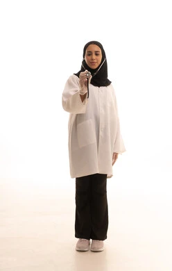 The concept of medicine and healthcare, diagnosing medical conditions, a portrait of a Saudi Gulf Arab female doctor wearing a white medical coat holding a stethoscope, providing medical services and assistance, working in the medical field, full-body, white background.