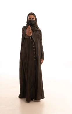Maintaining distance and avoiding surface contact, a portrait of a Saudi Arabian Gulf woman wearing a hijab, abaya, and mask, raising her hand with expressions of stopping and avoiding handshakes, following preventive measures against COVID-19, full-body, white background.