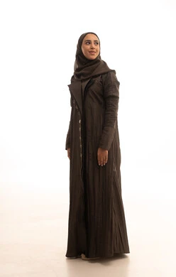 Expressions of joy and happiness, looking up with gestures of self-confidence, attention and care for external appearance, a portrait of a Saudi Arabian Gulf woman wearing a hijab and an abaya standing upright, the concept of femininity and softness, full-length body, white background.