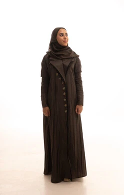 Looking up with gestures of self-confidence, attention and care for the external appearance, a portrait of a Saudi Arabian Gulf woman wearing a hijab and an abaya standing upright, expressions of joy and happiness, the concept of femininity and softness, full-body, white background.