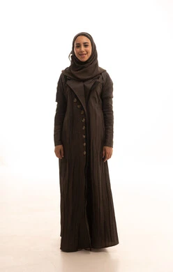 Attention and care for the external appearance, a portrait of a Saudi Arabian Gulf woman wearing a hijab and an abaya, standing upright, looking at the camera with gestures of self-confidence, expressions of joy and happiness, the concept of femininity and softness, full-body, white background.