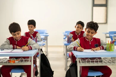 Performing school assignments, returning to school, preparing for the new academic year, education in Saudi Arabia, a group of Arab Gulf Saudi students sitting in their seats and doing their homework. Performing school assignments, returning to school, preparing for the new academic year, education in Saudi Arabia, a group of Arab Gulf Saudi students sitting in their seats and doing their homework.