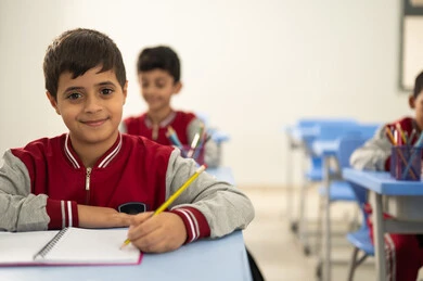 Preparation for the new school year, education in Saudi Arabia, completing school assignments, returning to school, a group of Arab Gulf Saudi students sitting in their seats and doing their homework. Preparation for the new school year, education in Saudi Arabia, completing school assignments, returning to school, a group of Arab Gulf Saudi students sitting in their seats and doing their homework.