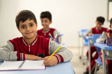 Preparation for the new school year, education in Saudi Arabia, completing school assignments, returning to school, a group of Arab Gulf Saudi students sitting in their seats and doing their homework. Preparation for the new school year, education in Saudi Arabia, completing school assignments, returning to school, a group of Arab Gulf Saudi students sitting in their seats and doing their homework.