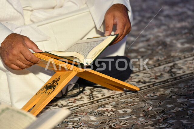 A class for memorizing the Noble Qur’an, children gathering to memorize the Noble Qur’an in the mosque, worship and getting closer to God