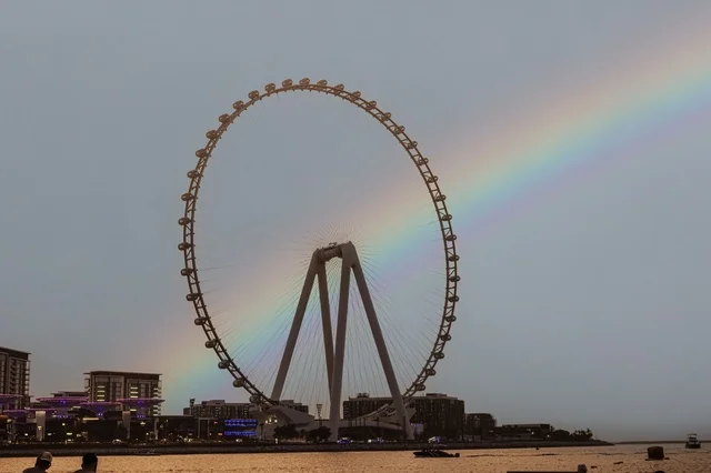 The Ferris wheel on JBR beach in the Emirate of Dubai, tourist attractions in the United Arab Emirates, places that attract and draw tourists, luxury hotels and resorts overlooking the Arabian Gulf coast.
