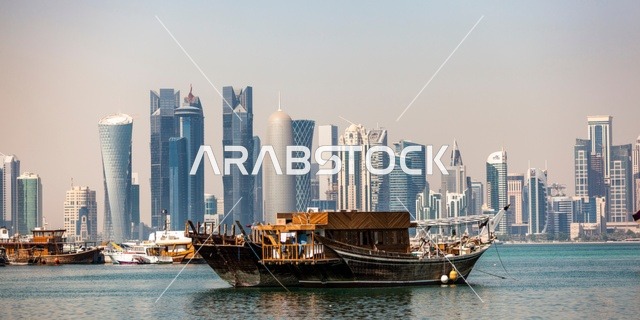 Coastal natural areas and places to attract tourists, the waterfront of the Arabian Sea on the Arabian Gulf, the architectural engineering art of towers and skyscrapers in the Dafna area of Qatar, the growth and urban development in the modern style of buildings overlooking the Corniche of Doha.