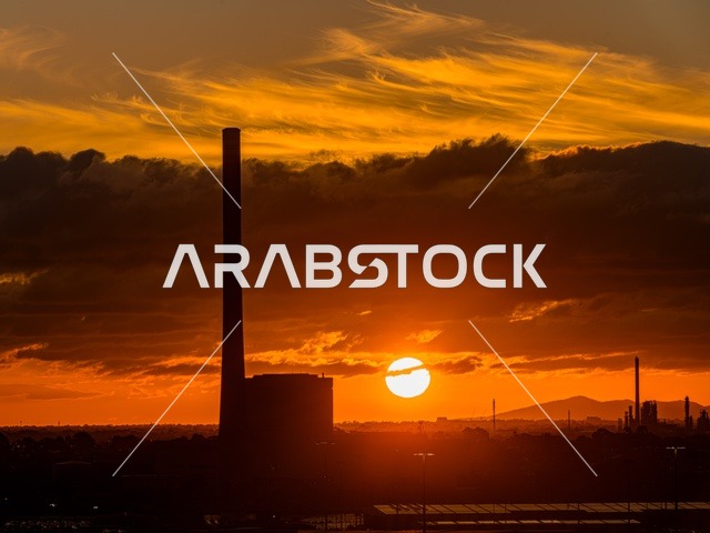A beautiful silhouette image of power lines at sunset, a sunset view in the sky of Saudi Arabia, a power station, electrical energy, a power distribution station in Saudi Arabia.