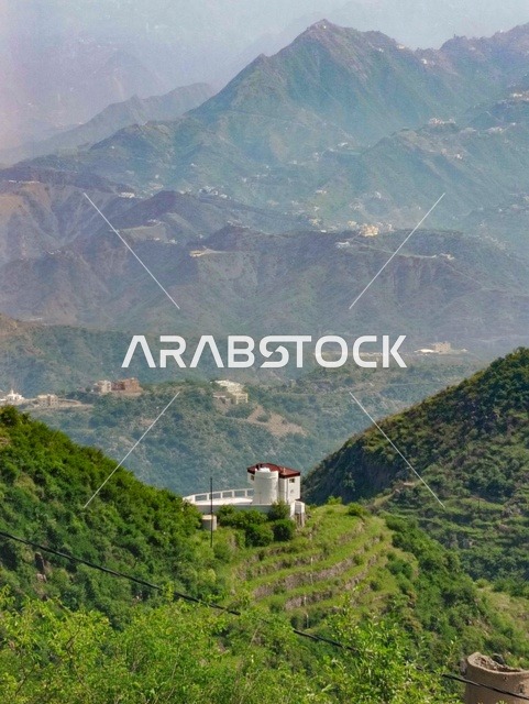 The distinctive landscapes, the enchanting nature in the province of Faifa in the Jazan region in the south of the Kingdom of Saudi Arabia, the famous tourist spots, the green plants and trees on the peaks and mountainous heights in the Jazan region.