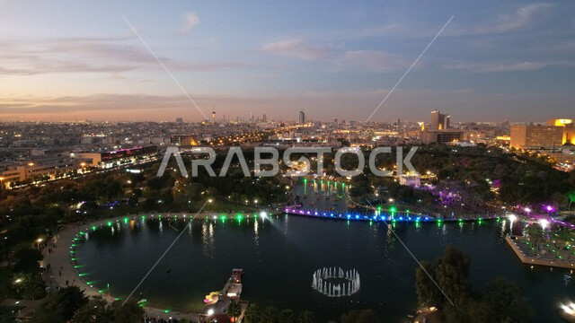 Aesthetic image at sunset of Salam Park in Riyadh, a wonderful artificial lake, enjoying the landscape, spending fun family times, Saudi Arabia