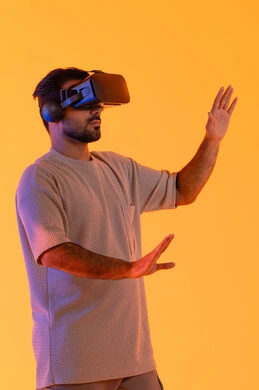 Simulation of the imaginary world, happiness in seeing imaginary scenes, using modern technological devices, interaction and immersion with virtual reality, a portrait of a young Emirati Arab man wearing casual attire and VR glasses, a Saudi man enjoying his leisure time, yellow background. Simulation of the imaginary world, happiness in seeing imaginary scenes, using modern technological devices, interaction and immersion with virtual reality, a portrait of a young Emirati Arab man wearing casual attire and VR glasses, a Saudi man enjoying his leisure time, yellow background.