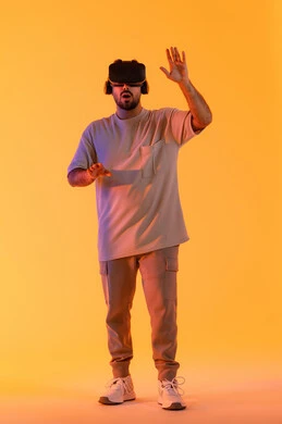The use of modern technical devices and technology to see imaginary scenes, interact and integrate with virtual reality, a portrait of a young Arab Gulf Emirati man wearing casual attire and VR glasses, a Saudi man enjoying his leisure time, full body length, yellow background.