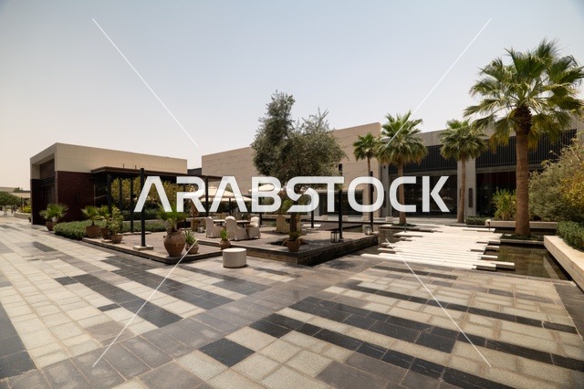 Entertainment and leisure centers and commercial shopping in the city of Riyadh, the Riyadh Front project, outdoor seating areas at the Roshan Front during the day, a recreational and tourist area in the Kingdom of Saudi Arabia, fun family activities and events.