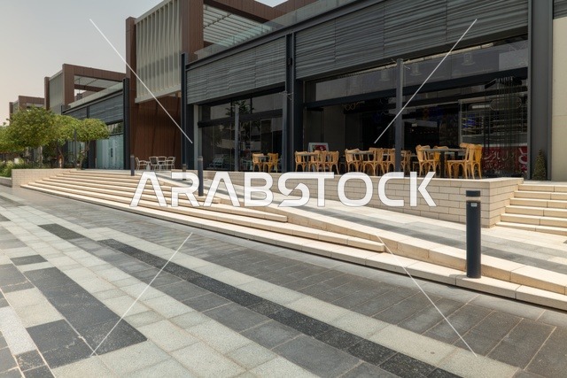 Entertainment and leisure centers and commercial shopping in the city of Riyadh, the Riyadh Front project, outdoor seating areas at the Roshan Front during the day, a recreational and tourist area in the Kingdom of Saudi Arabia, fun family activities and events.