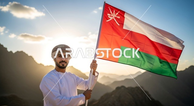 الأعياد والمناسبات الوطنية, حب الوطن والانتماء إليه، إرجل عربي خليجي عماني يرتدي الكمة والدشداشة يمسك علم السلطنة، الاحتفال بذكرى اليوم الوطني العماني 18 نوفمبر، إحياء ذكرى تأسيس الدولة 1775 م، الاعتزاز والفخر بالرموز والراية