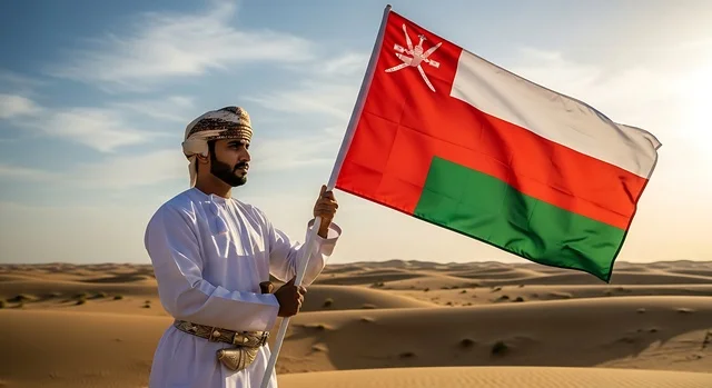 الأعياد والمناسبات الوطنية, حب الوطن والانتماء إليه، إرجل عربي خليجي عماني يرتدي الكمة والدشداشة يمسك علم السلطنة، الاحتفال بذكرى اليوم الوطني العماني 18 نوفمبر، إحياء ذكرى تأسيس الدولة 1775 م، الاعتزاز والفخر بالرموز والراية