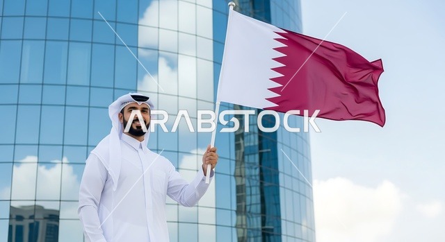 الاحتفال باليوم الوطني القطري 18 ديسمبر، إحياء ذكرى تأسيس الدولة، رجل عربي خليجي قطري يحمل علم قطر بايماءات الفخروالاعتزاز، رموز وثقافات وطنية, حب الوطن والانتماء إليه