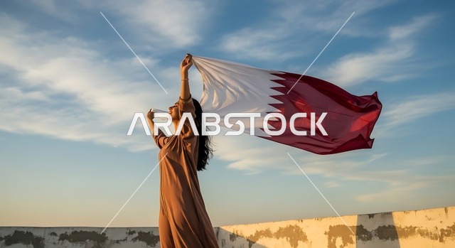 الاحتفال باليوم الوطني القطري 18 ديسمبر، إحياء ذكرى تأسيس الدولة، إمرأة عربية خليجية قطرية تحمل علم قطر بايماءات الفخروالاعتزاز، رموز وثقافات وطنية, حب الوطن والانتماء إليه