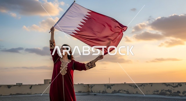 الاحتفال باليوم الوطني القطري 18 ديسمبر، إحياء ذكرى تأسيس الدولة، إمرأة عربية خليجية قطرية تحمل علم قطر بايماءات الفخروالاعتزاز، رموز وثقافات وطنية, حب الوطن والانتماء إليه