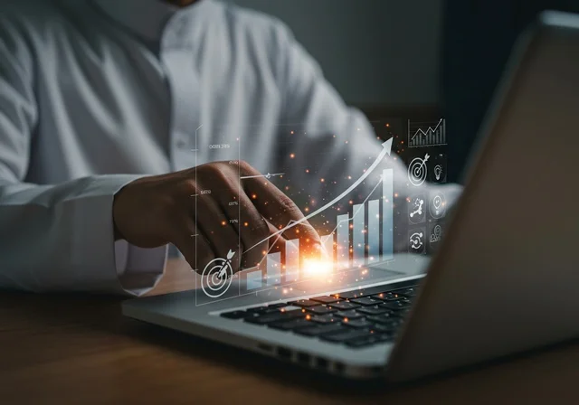 Statistical charts for the financial stock market using 3D hologram technology, digital e-commerce, a close-up image of a man's hands working on a laptop, monitoring stock indices and financial investment charts, growth and development in the economic field in Saudi Arabia.