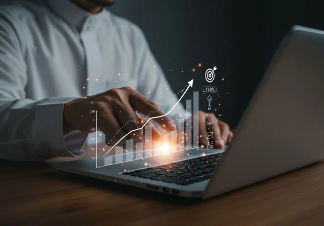 Statistical charts for the financial stock market using 3D hologram technology, digital e-commerce, a close-up image of a man's hands working on a laptop, monitoring stock indices and financial investment charts, growth and development in the economic field in Saudi Arabia.
